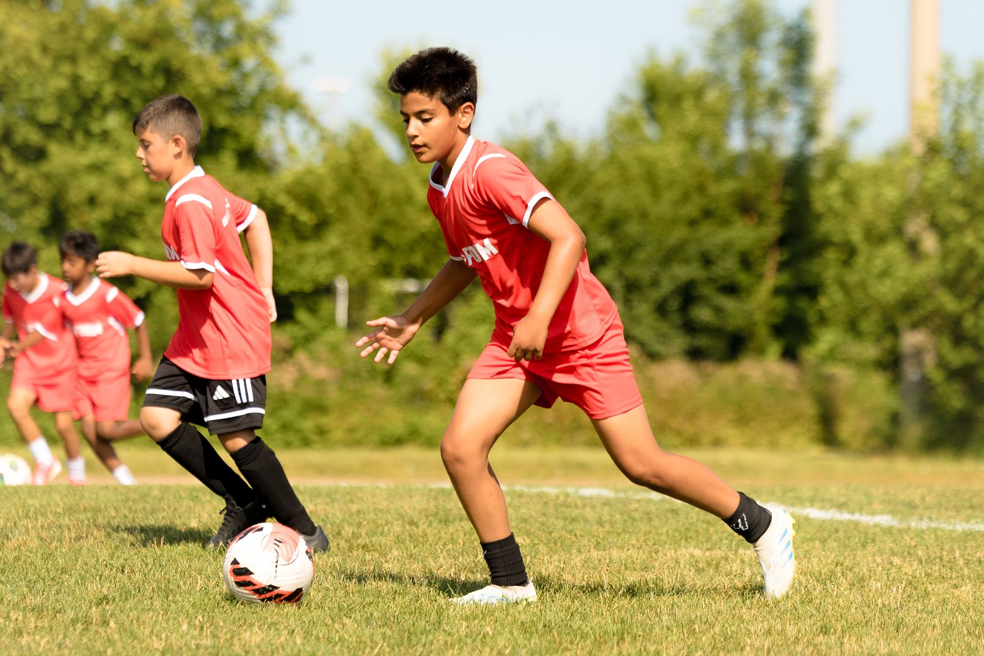 Camper dribbling at summer camp
