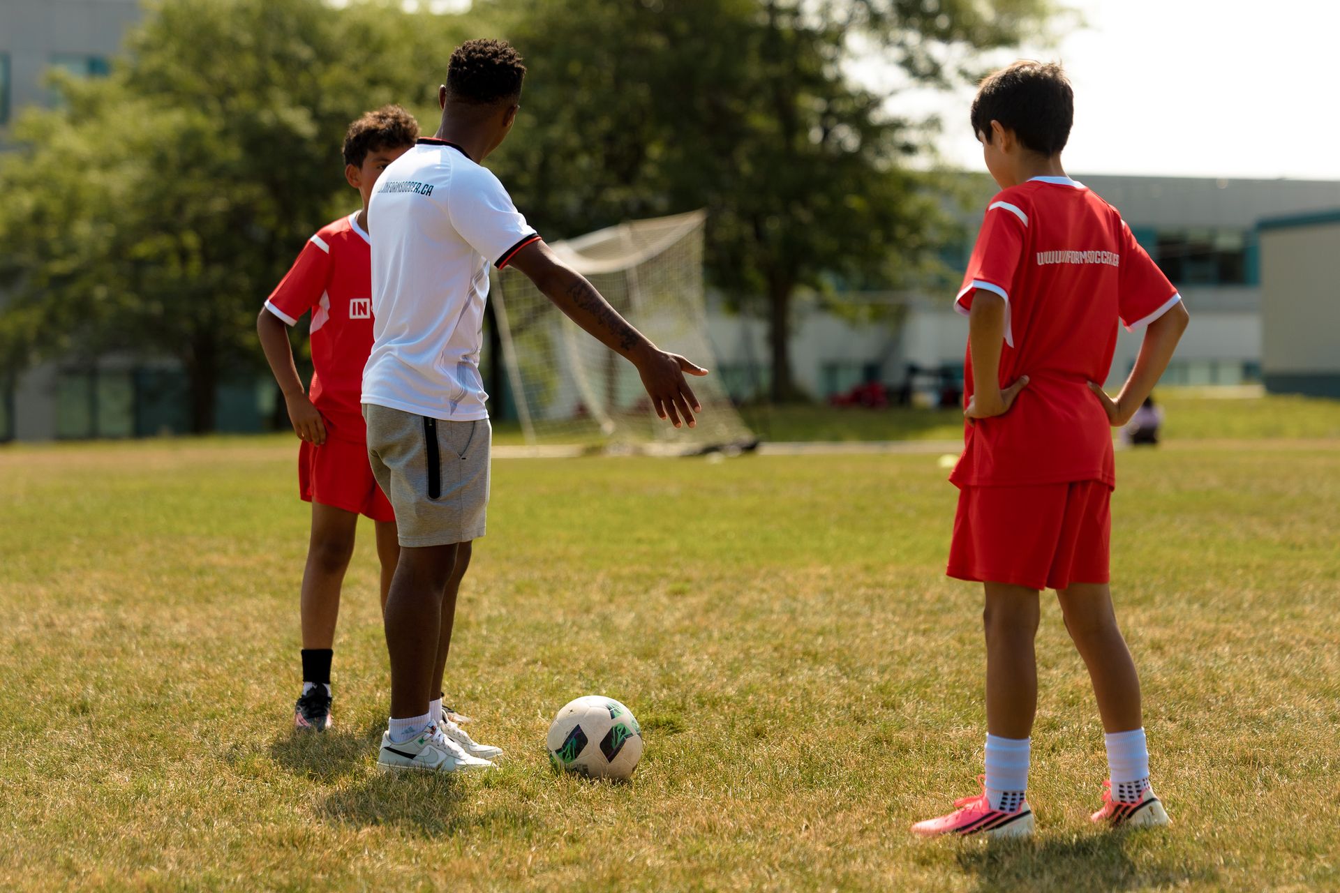 Coach instructing campers